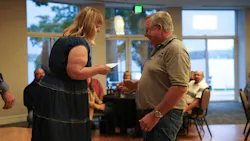 Jackie Worzalla, FLASH safety manager, at left, recognizes local driver Brian McConnell for his 3 million accident-free miles with the company over the last 38 years.