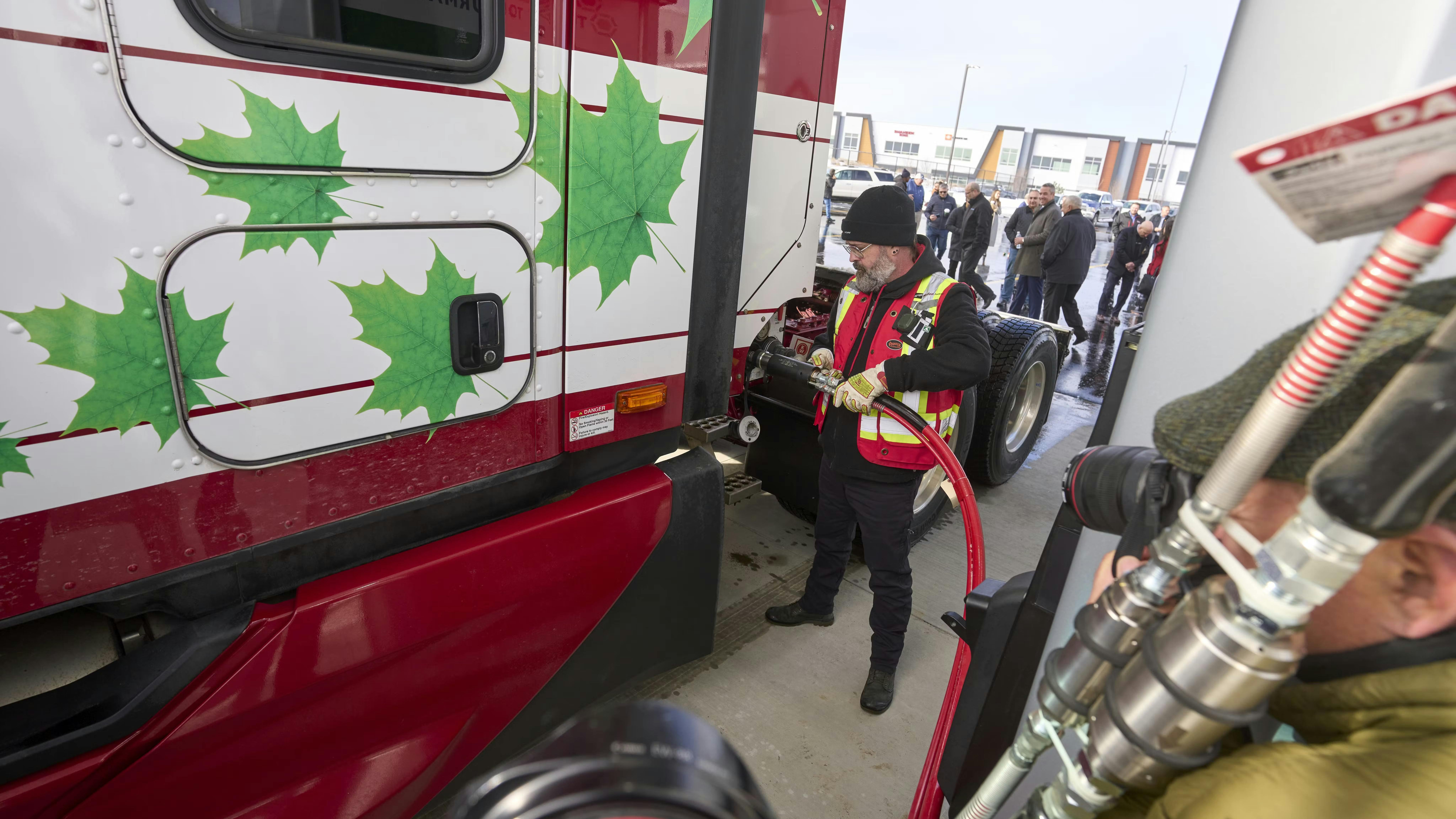 A Mullen Group driver demonstrates how to fuel up with CNG at the new Tourmaline and Clean Energy CNG station in Calgary, Alberta, Canada.