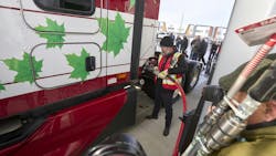 A Mullen Group driver demonstrates how to fuel up with CNG at the new Tourmaline and Clean Energy CNG station in Calgary, Alberta, Canada. A Mullen Group driver demonstrates how to fuel up with CNG at the new Tourmaline and Clean Energy CNG station in Calgary, Alberta, Canada.