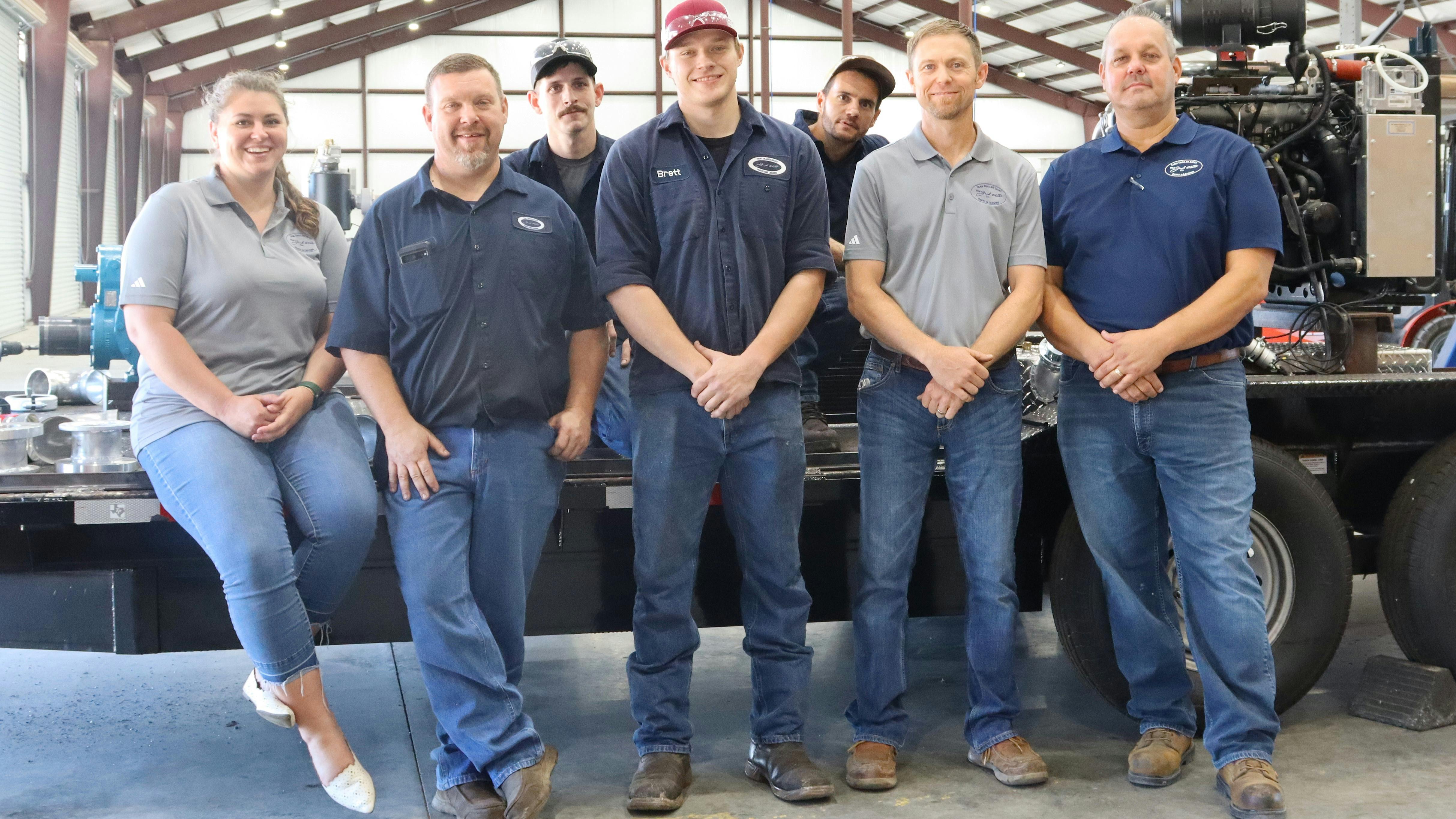 Tank Works CEO Joe Kogut, at right, and Spencer Ehlert, second from right, lead the new Olsta Co. rig-out team.