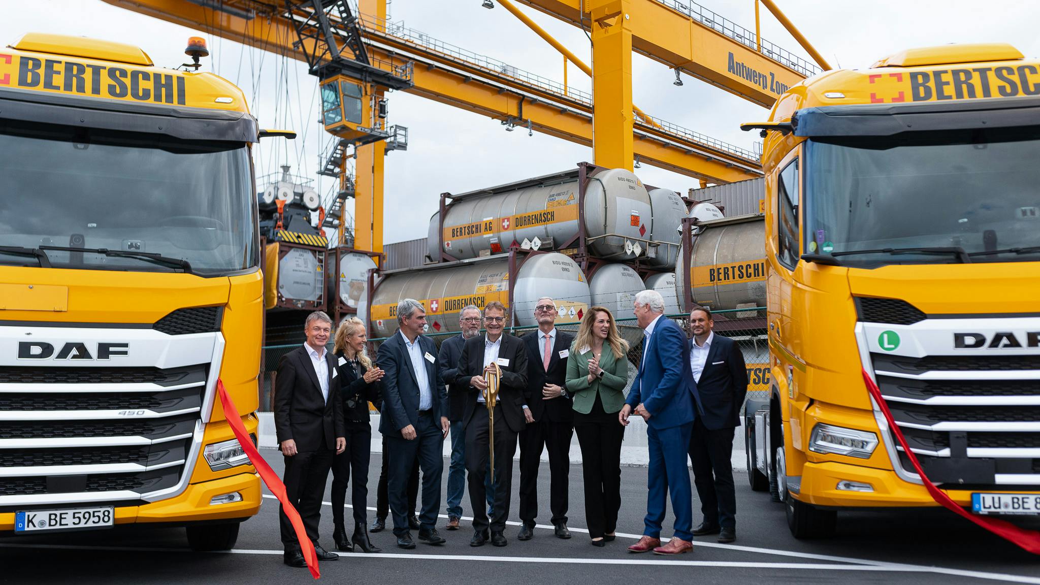 Ribbon-cutting celebration at the AZT terminal with Bertschi representatives.