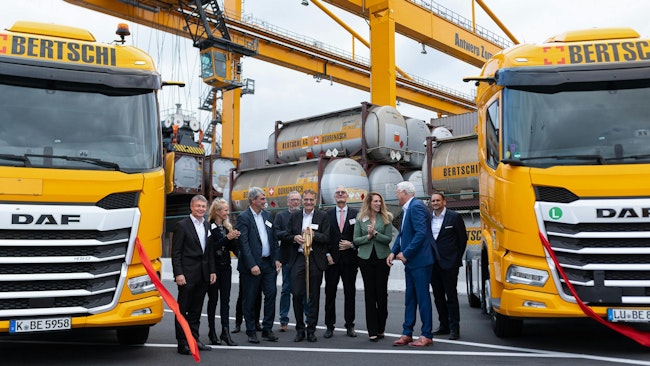 Ribbon-cutting celebration at the AZT terminal with Bertschi representatives.