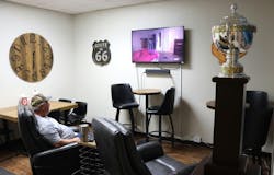 An LSP Transport driver awaits his next load in a lounge that features one of the fleet's two Heil trophies. An LSP Transport driver awaits his next load in a lounge that features one of the fleet's two Heil trophies.