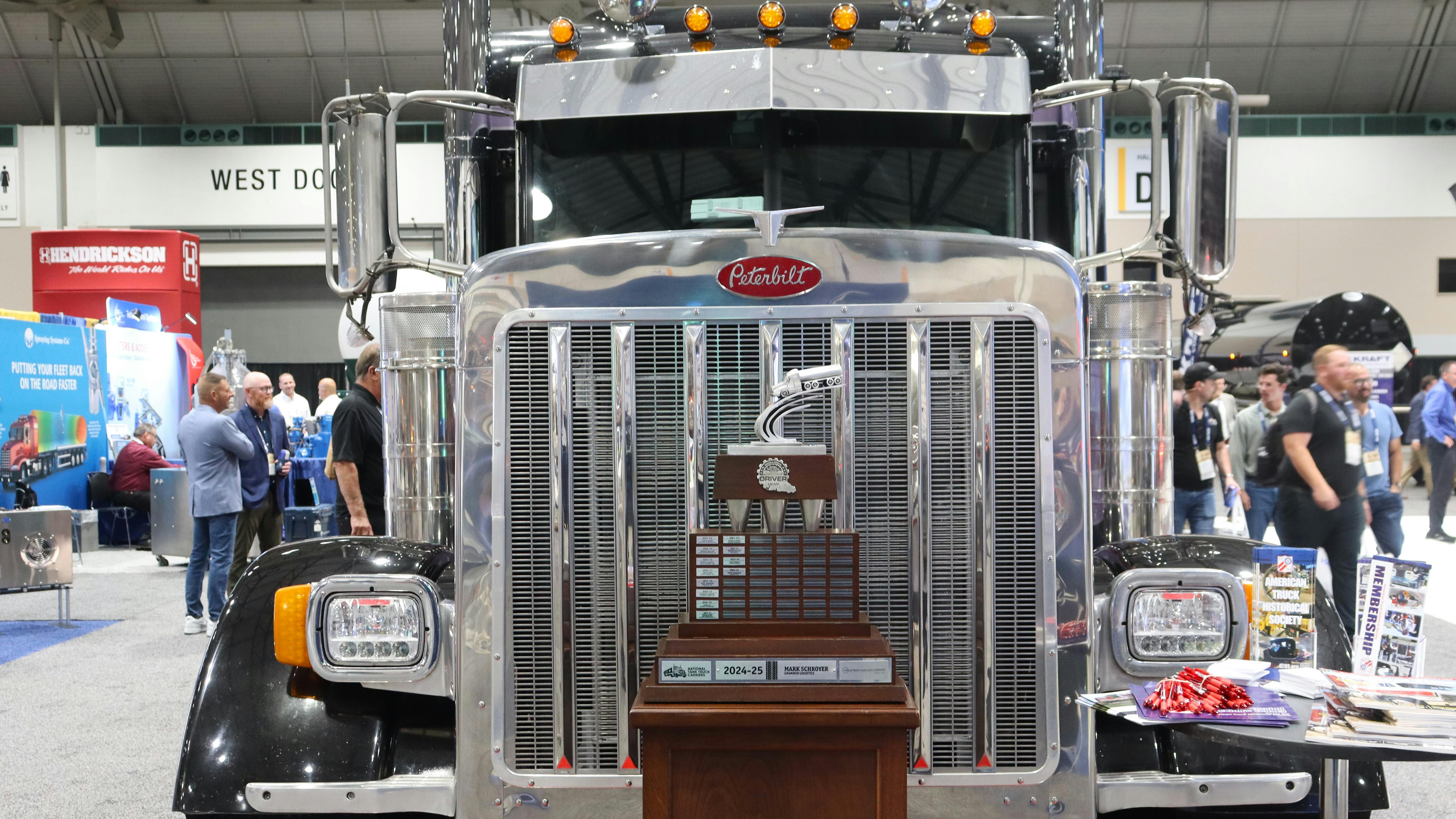 NTTC displayed the prestigious Usher trophy in front of reigning Driver of the year Mark Schroyer's custom Peterbilt tractor during Tank Truck Week 2025 in Kansas City, Missouri.