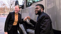 Sarah Abernethy, Kenworth director of marketing communications, at left, presents Charles Jones Jr. of Roehl Transport with the keys to his new Kenworth T680 tractor. Sarah Abernethy, Kenworth director of marketing communications, at left, presents Charles Jones Jr. of Roehl Transport with the keys to his new Kenworth T680 tractor.