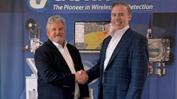 Bud Dungan, founder and CEO of Gastronics, at left, shakes hands with Kevin McKeigue, Safe Monitoring Group Americas president. Bud Dungan, founder and CEO of Gastronics, at left, shakes hands with Kevin McKeigue, Safe Monitoring Group Americas president.