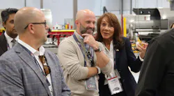 NTTC Chairman David Price, center, jokes with Hendricks Holding Chairman Diane Hendricks during a tour of STE's new trailing manufacturing facility. NTTC Chairman David Price, center, jokes with Hendricks Holding Chairman Diane Hendricks during a tour of STE's new trailing manufacturing facility.
