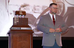 Bruce Jones gathers his emotions while standing next to the prestigious Usher trophy. Bruce Jones gathers his emotions while standing next to the prestigious Usher trophy.