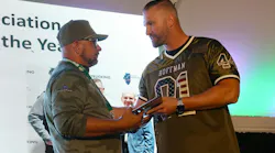 G&D Trucking/Hoffman Transportation Vice President Jordan Hoffman, at right, congratulates Bruce Jones for earning the Illinois Trucking Association's 2024 Driver of the Year award last year at G&D/Hoffman's annual employee appreciation event.