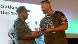 G&D Trucking/Hoffman Transportation Vice President Jordan Hoffman, at right, congratulates Bruce Jones for earning the Illinois Trucking Association's 2024 Driver of the Year award last year at G&D/Hoffman's annual employee appreciation event.