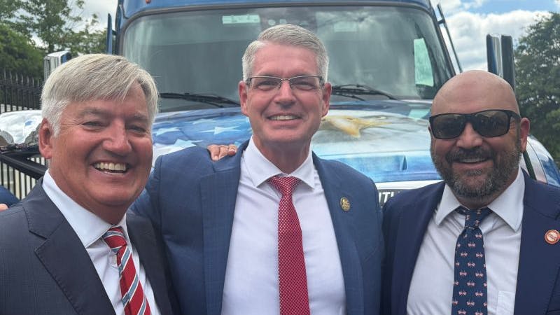 NTTC Advocacy Chair Hans Schaupp, at left, and NTTC Chairman Jeremy Mairs, at right, joined FMCSA Administrator Derek D. Barrs at the White House launch event for the new Freedom Haulers campaign.