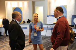 Ronnie McCoy, SWTO fleet safety, compliance, and training manager, at left, and Archie Wood, SWTO director of transport operations, at right, chat with Luma Brighter Learnign CEO Gina Anderson, whose company helped SWTO develop its customized Certified Driver Trainer program.