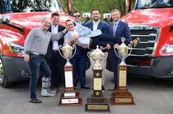 The Usher Transport crew celebrates their upliftting safety achievement by hoisting Beau Mosley, Usher's chief risk officer, off his feet.