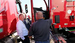 Groendyke driver Jeff Parmiter showcases the carrier’s modern equipment to Hern and ATA Chairman Greg Hodgen during a facility tour.