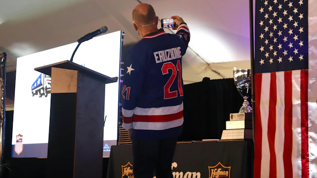 G&D/Hoffman Chief Operating Officer Jerry Curl takes a selfie on stage for Mike Eruzione, captain of the 1980 U.S. Olympic hockey team, who was originally scheduled to deliver the keynote address but had his flight nixed by inclement weather.