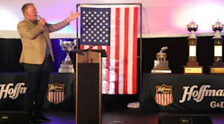 Legendary singer Jim Cornelison delivers a surprise, rousing performance of the national anthem alongside G&D/Hoffman’s collection of national safety trophies. When severe weather grounded scheduled guest speakers at the 17th annual employee appreciation event, company leaders executed a flawless pivot to save the massive celebration, perfectly reflecting the event’s “hold the line” theme of meeting unexpected challenges proactively.
