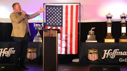 Legendary singer Jim Cornelison delivers a surprise, rousing performance of the national anthem alongside G&D/Hoffman’s collection of national safety trophies. When severe weather grounded scheduled guest speakers at the 17th annual employee appreciation event, company leaders executed a flawless pivot to save the massive celebration, perfectly reflecting the event’s “hold the line” theme of meeting unexpected challenges proactively.
